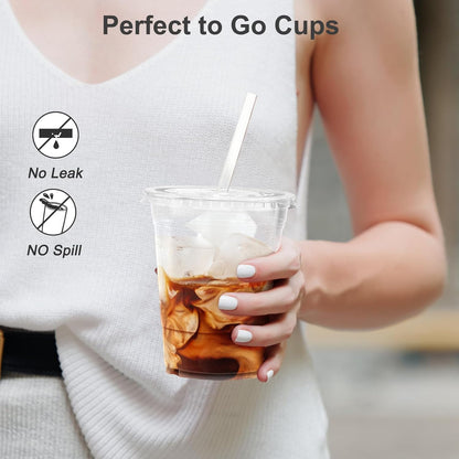 Pack of 100 - 16 oz clear plastic disposable iced coffee cups with lids.